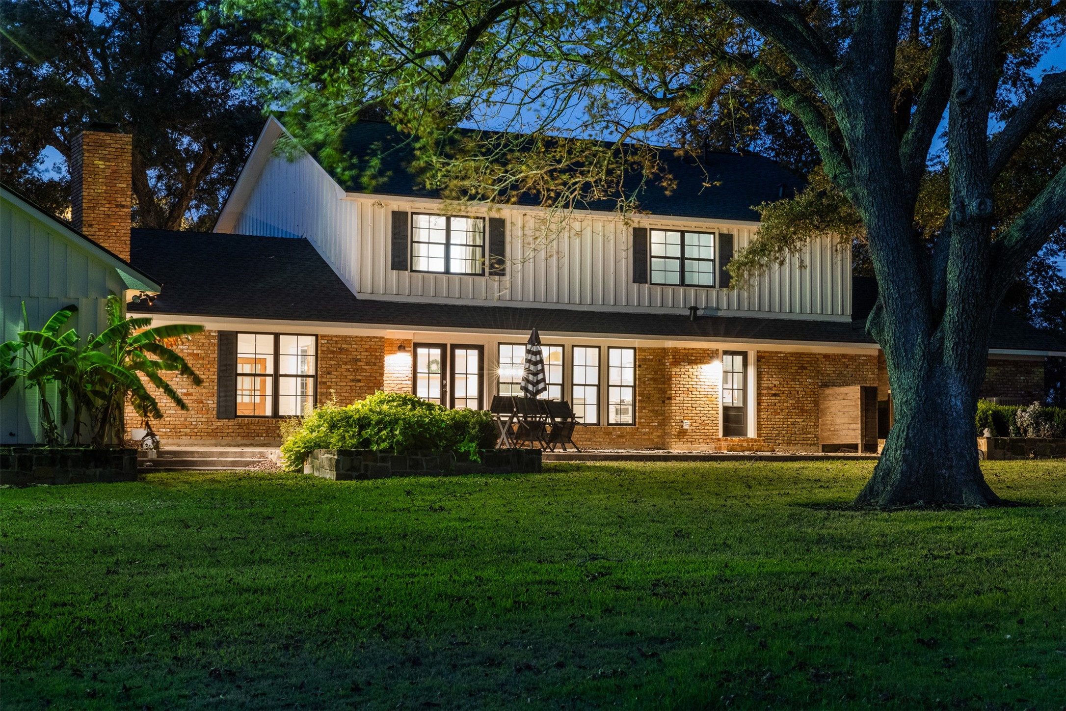 351 Pleasant Hill School Road Brenham, TX 77833 - Photo 46 of 46 a front view of a house with a yard table and chairs