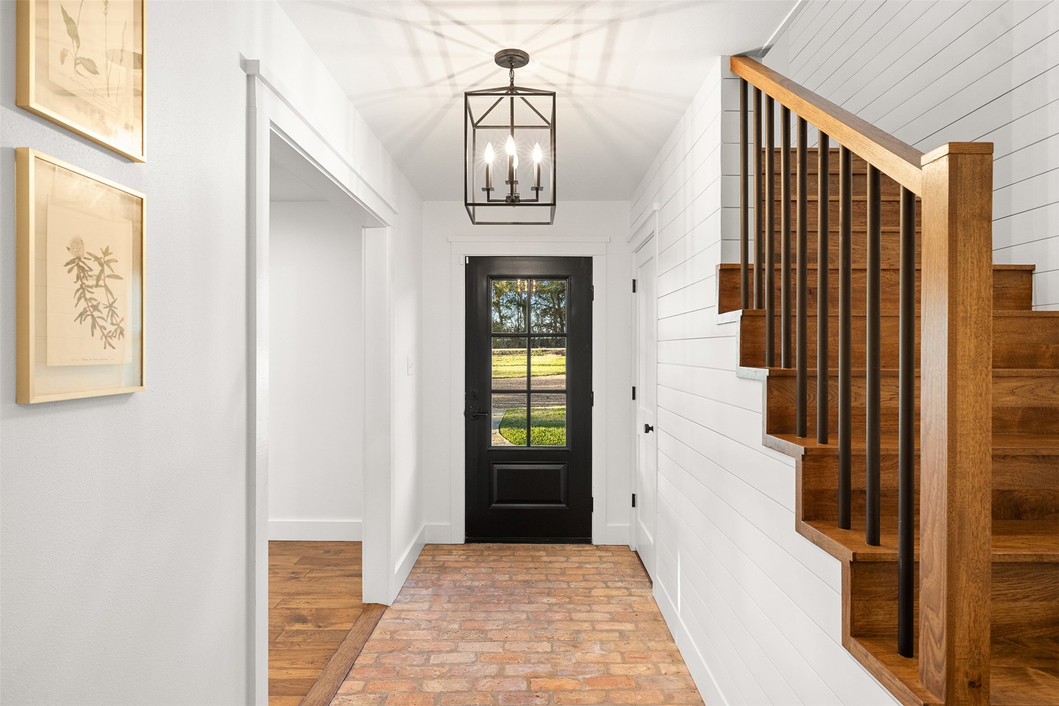 351 Pleasant Hill School Road Brenham, TX 77833 - Photo 5 of 46 a view of a hallway with wooden floor and staircase