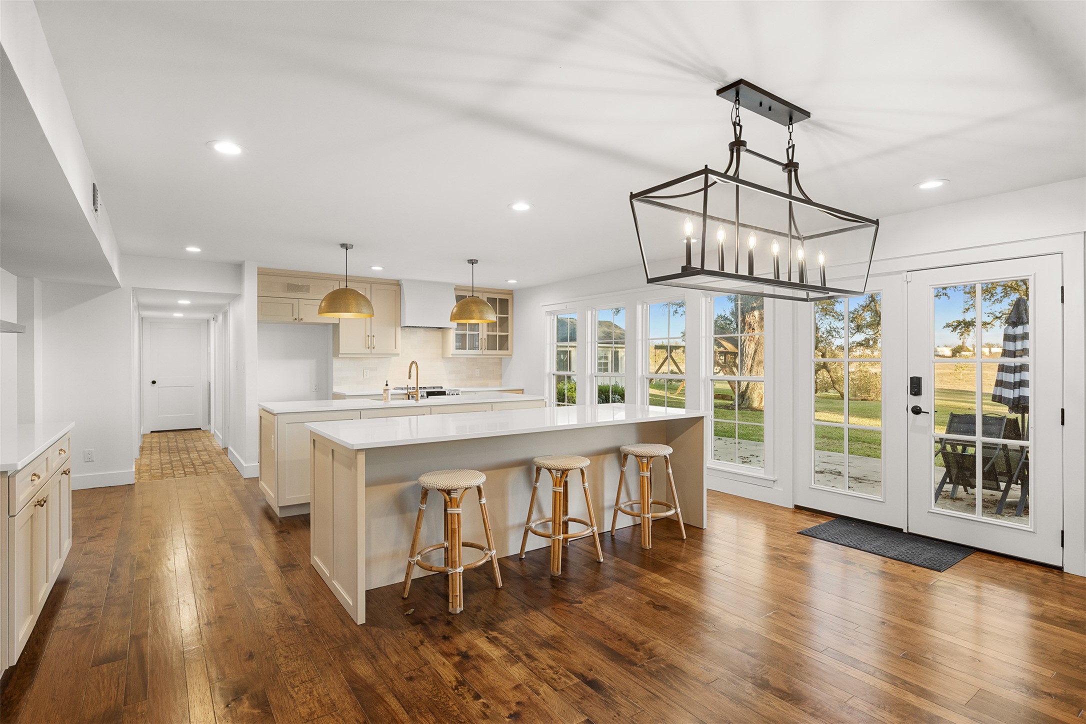 351 Pleasant Hill School Road Brenham, TX 77833 - Photo 8 of 46 a view of a kitchen with dining space wooden floor electric appliances