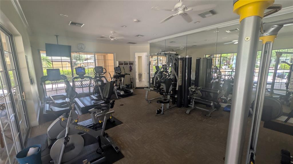 6552 Moorings Point Circle, Unit 102 Lakewood Ranch, FL 34202 - Photo 42 of 57 a view of a room with gym equipment