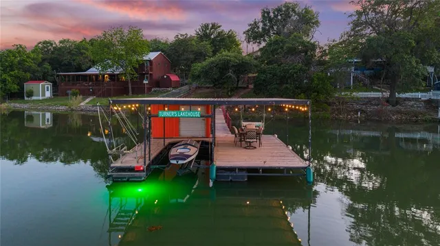 a view of a wooden deck and lake view