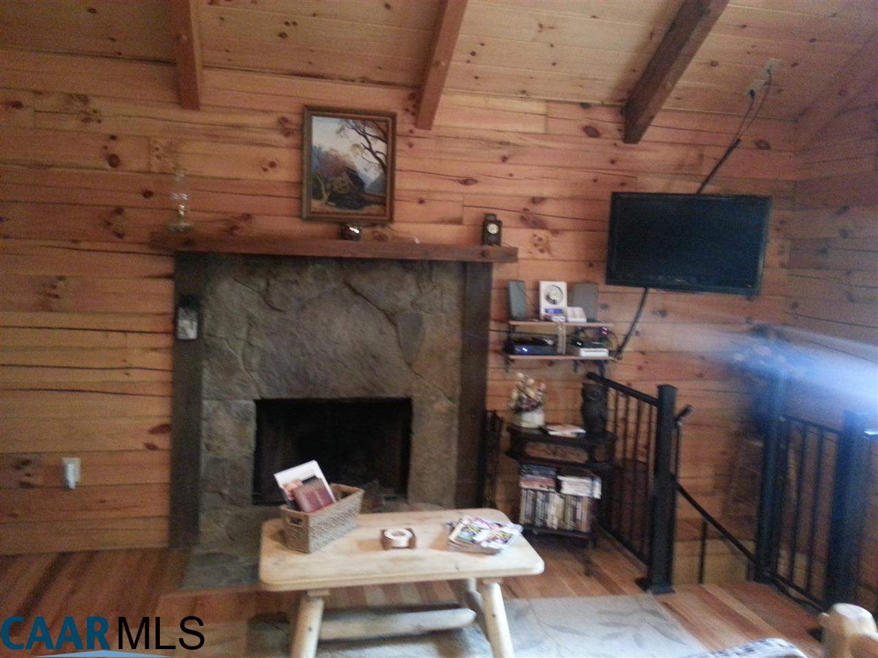 1673 Turkey Ridge Road Stanardsville, VA 22973 - Photo 3 of 12 a living room with furniture and a fireplace