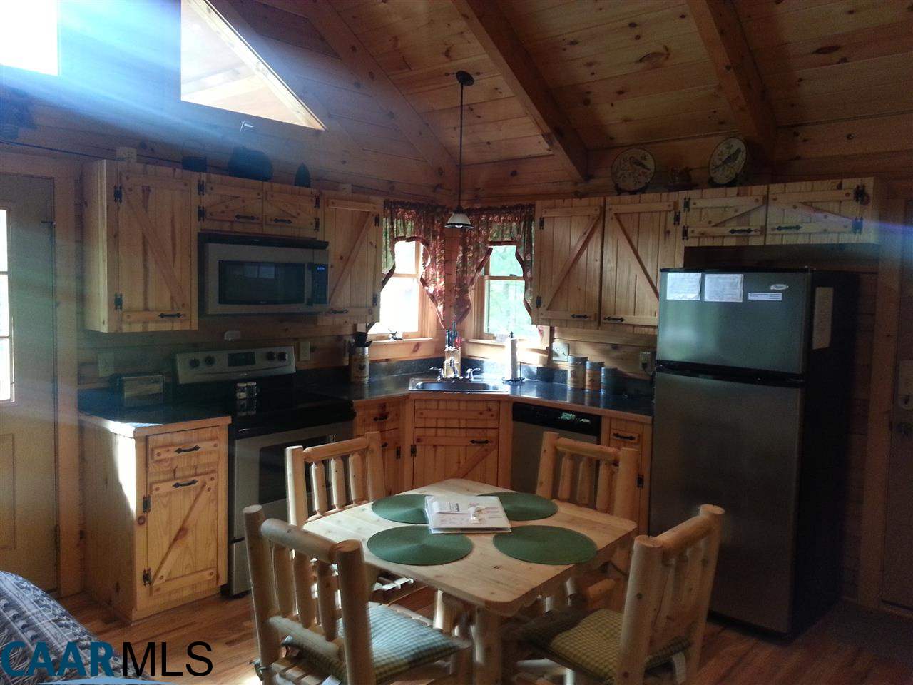 1673 Turkey Ridge Road Stanardsville, VA 22973 - Photo 6 of 12 a kitchen with granite countertop lots of counter top space and dining table