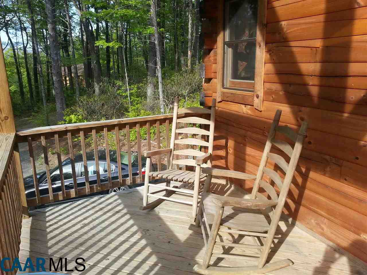 1673 Turkey Ridge Road Stanardsville, VA 22973 - Photo 9 of 12 a view of balcony with wooden floor and outdoor seating