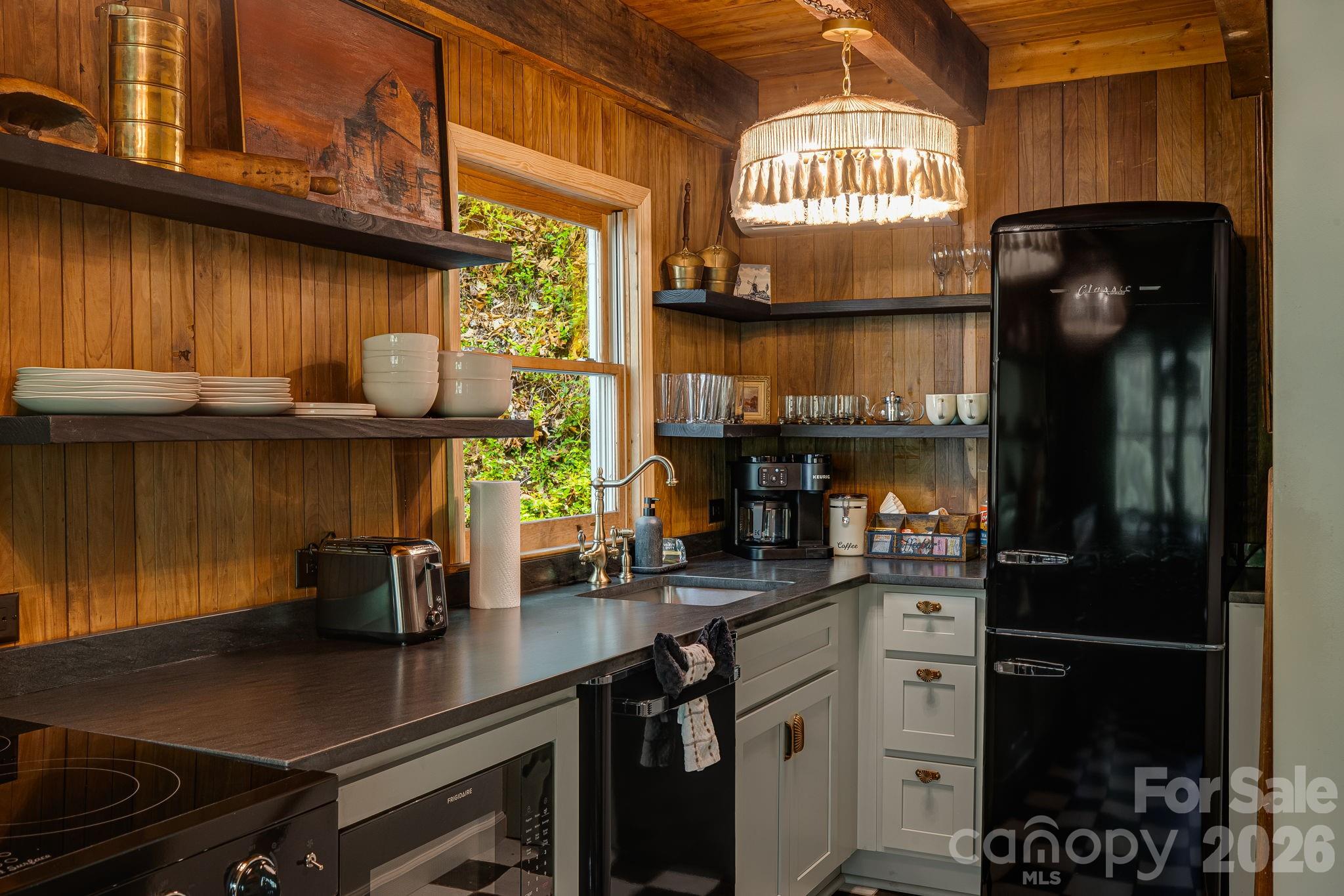 155 Spivey Mountain Road Asheville, NC 28806 - Photo 24 of 48 a kitchen with a sink cabinets and window