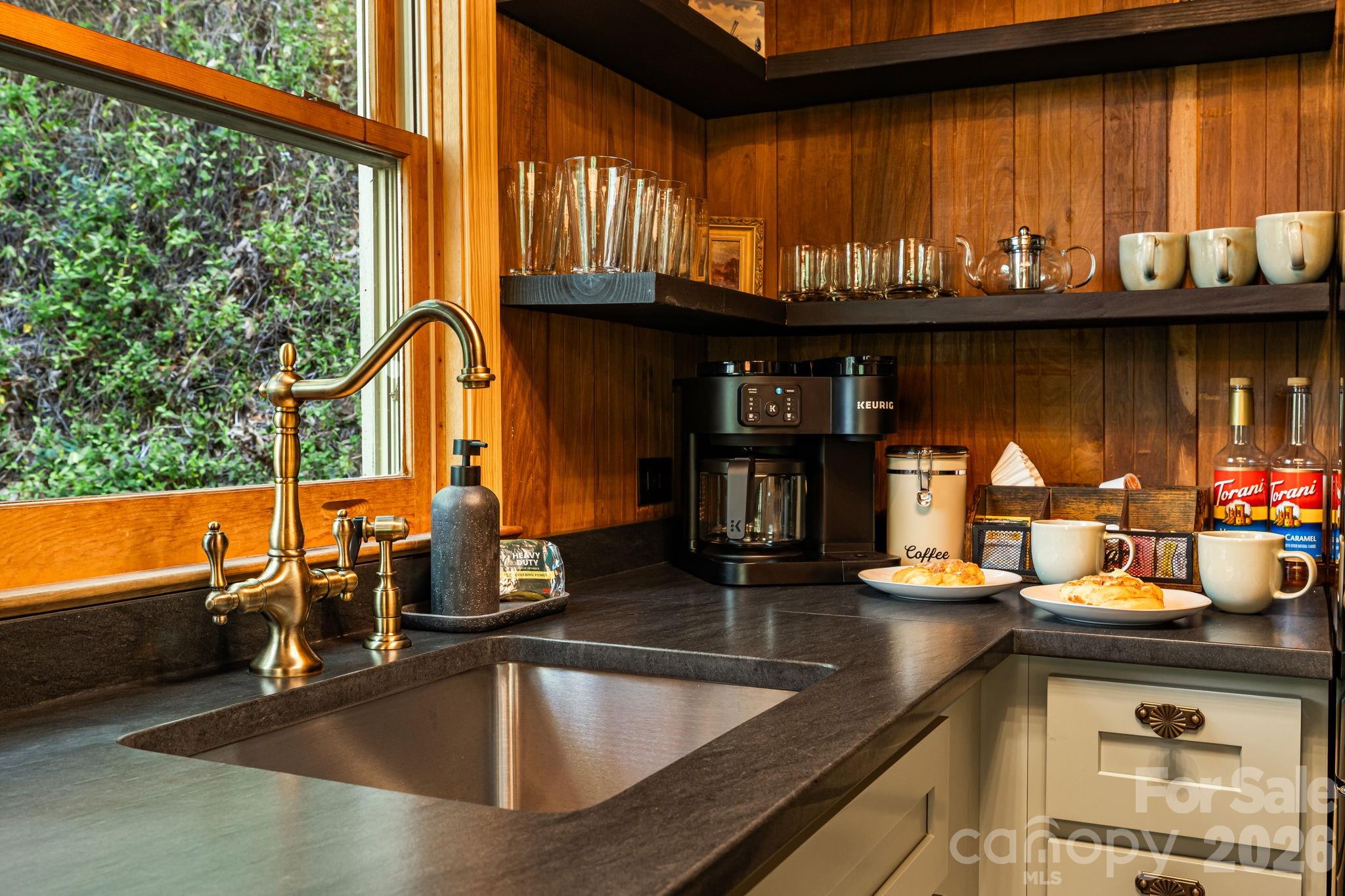 155 Spivey Mountain Road Asheville, NC 28806 - Photo 25 of 48 a kitchen counter top with a sink and cabinets
