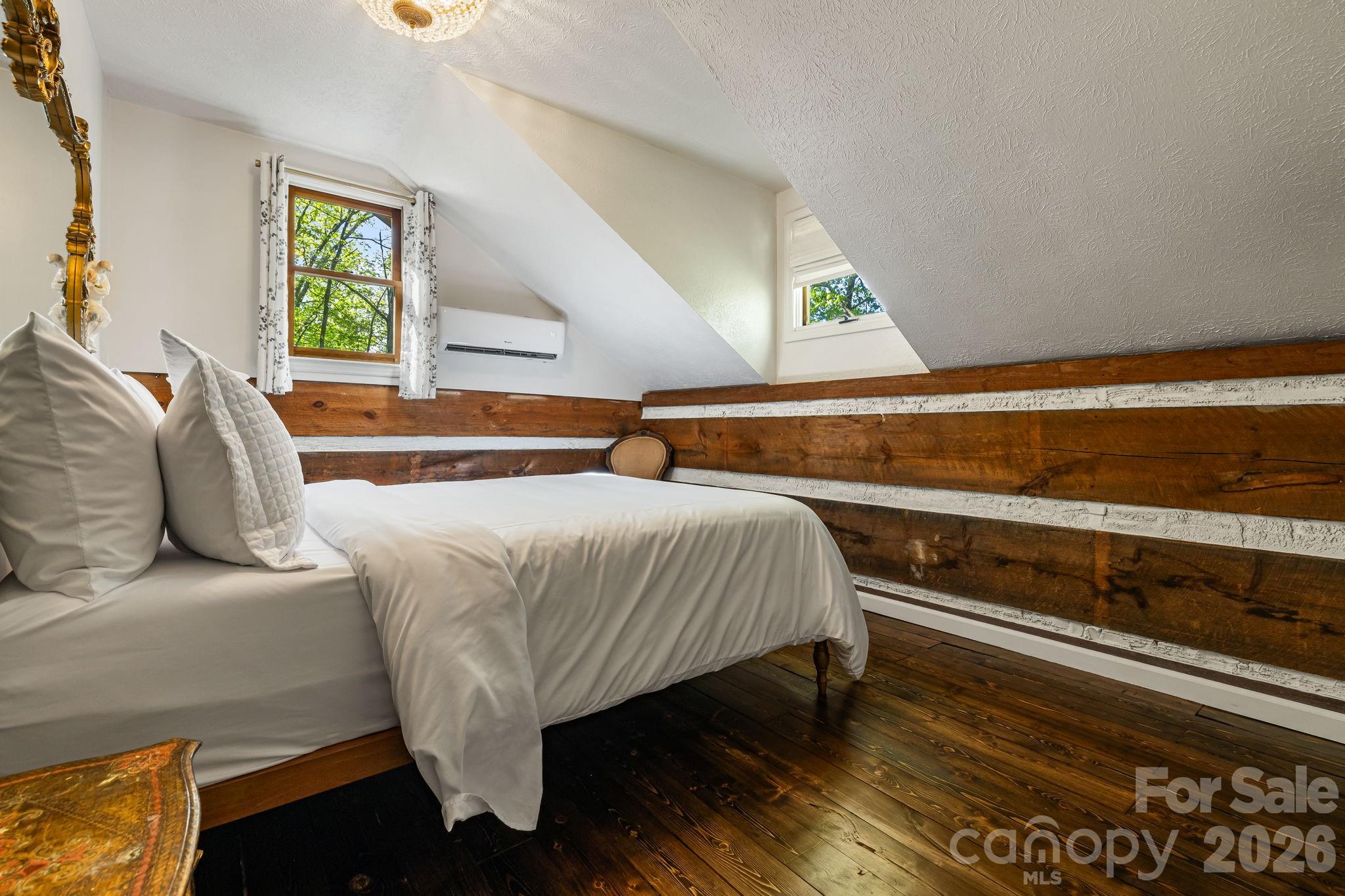155 Spivey Mountain Road Asheville, NC 28806 - Photo 30 of 48 a bedroom with a bed and window
