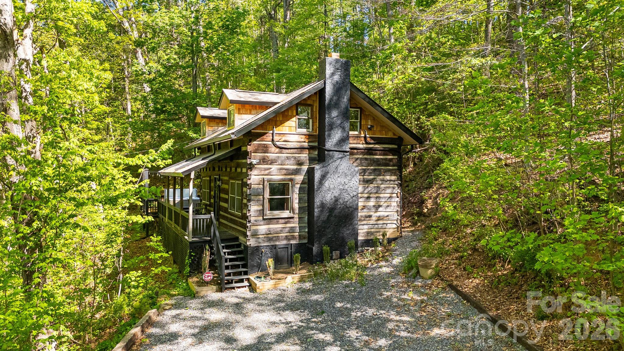155 Spivey Mountain Road Asheville, NC 28806 - Photo 39 of 48 a yellow house with a tree in the background