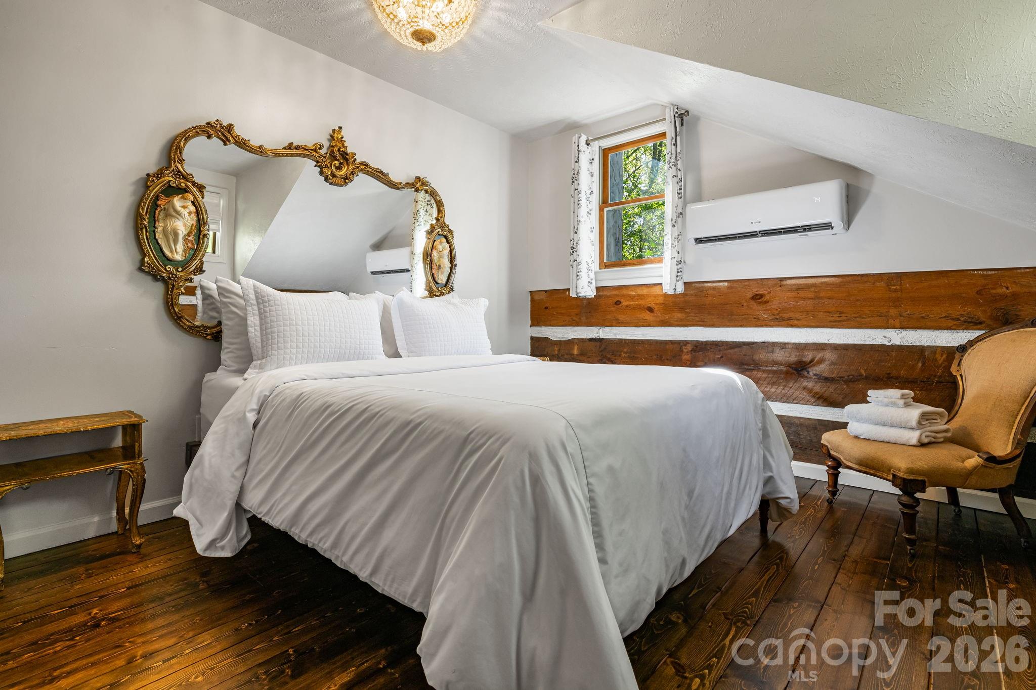155 Spivey Mountain Road Asheville, NC 28806 - Photo 8 of 48 a bedroom with a bed and wooden floor