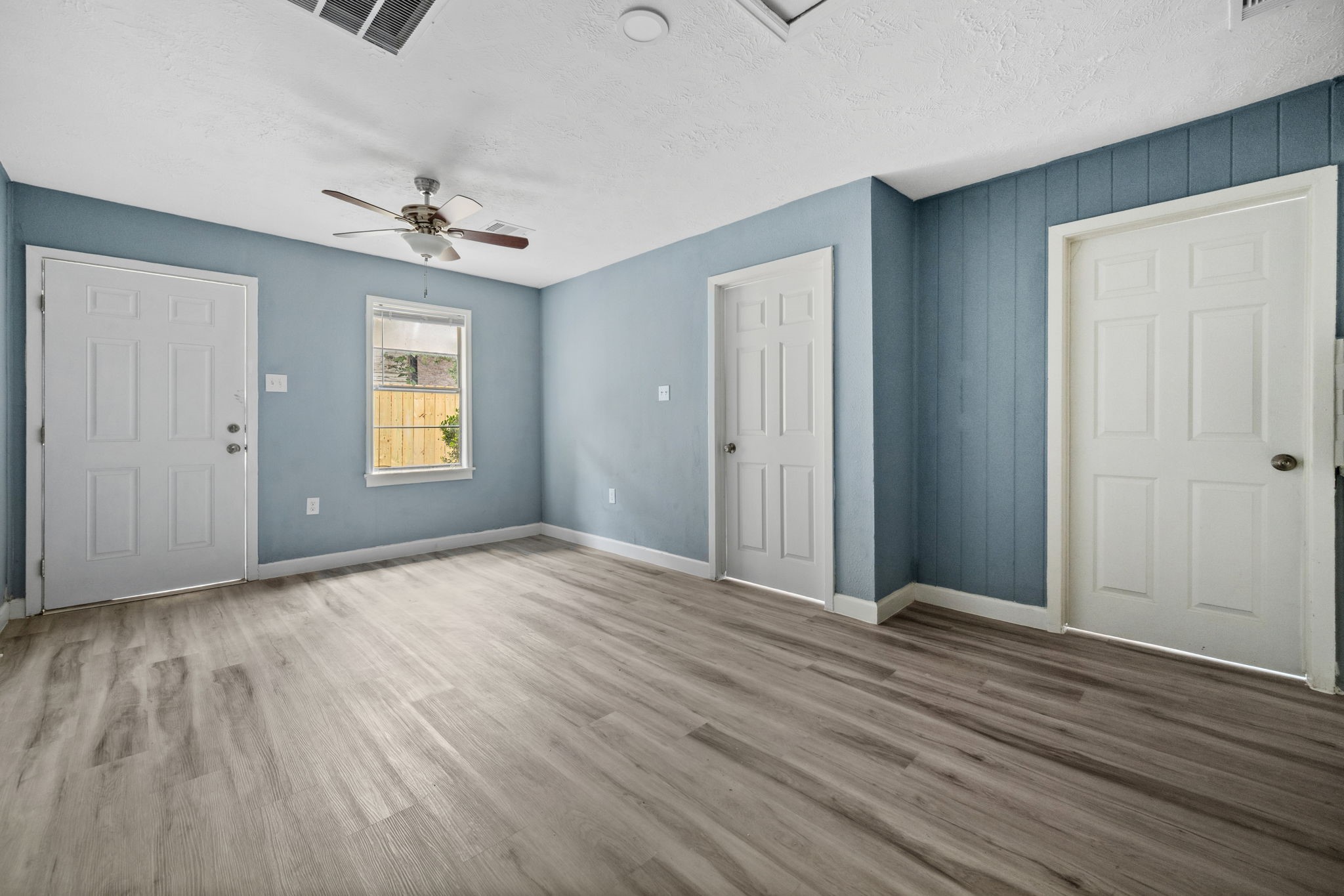3425 Nettleton Street, Unit 1 Houston, TX 77004 - Photo 3 of 12 a view of empty room with wooden floor and fan