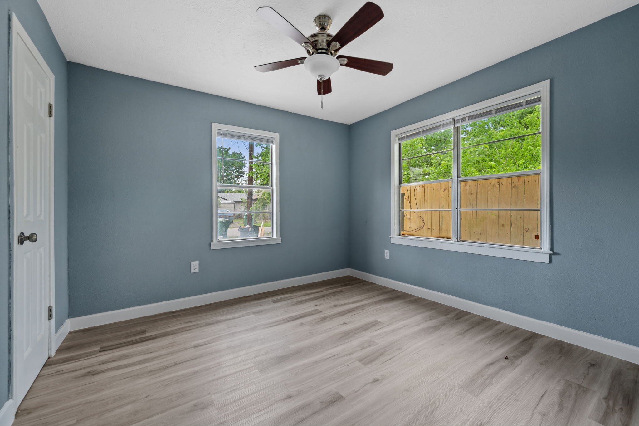 3425 Nettleton Street, Unit 1 Houston, TX 77004 - Photo 9 of 12 a view of an empty room with wooden floor and a window