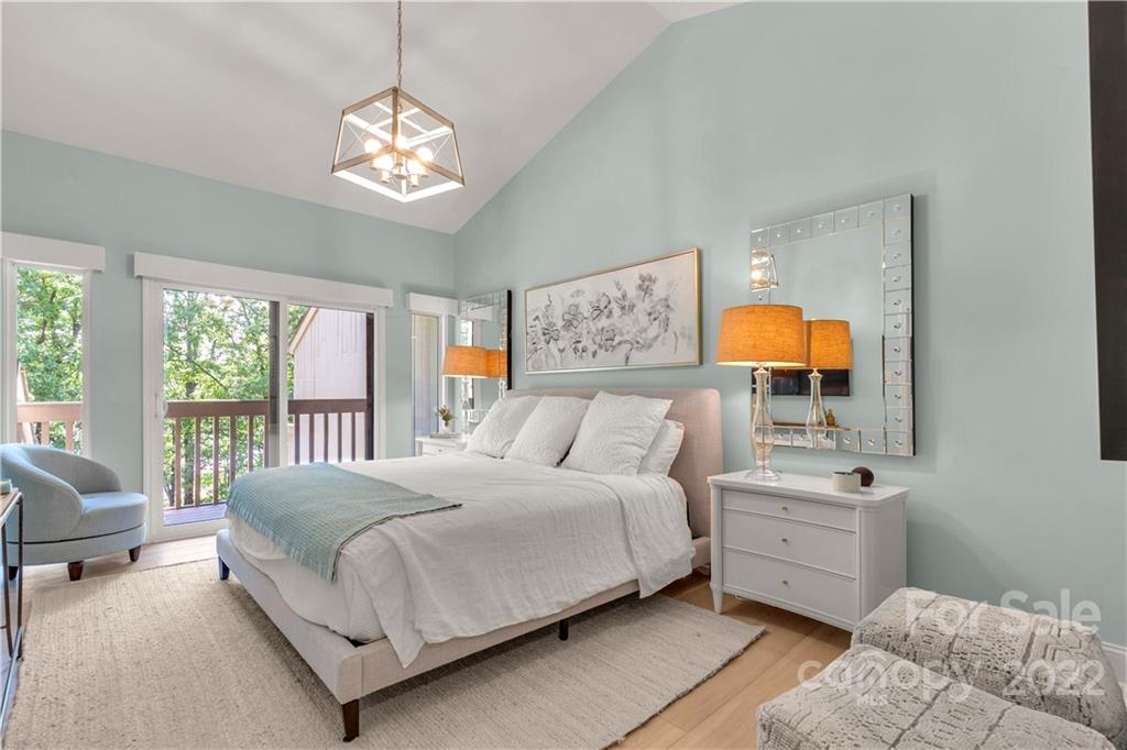 62 Ridgeport Road Clover, SC 29710 - Photo 15 of 41 a bedroom with a bed and a chandelier