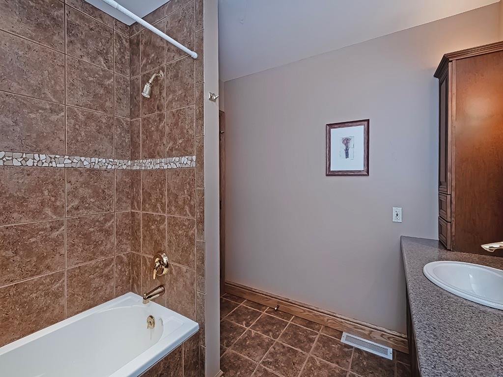 166 McKay Road Saxonburg, PA 16056 - Photo 35 of 48 a bathroom with a granite countertop sink a toilet and shower