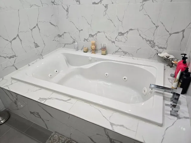 a bathroom with a bathtub and sink