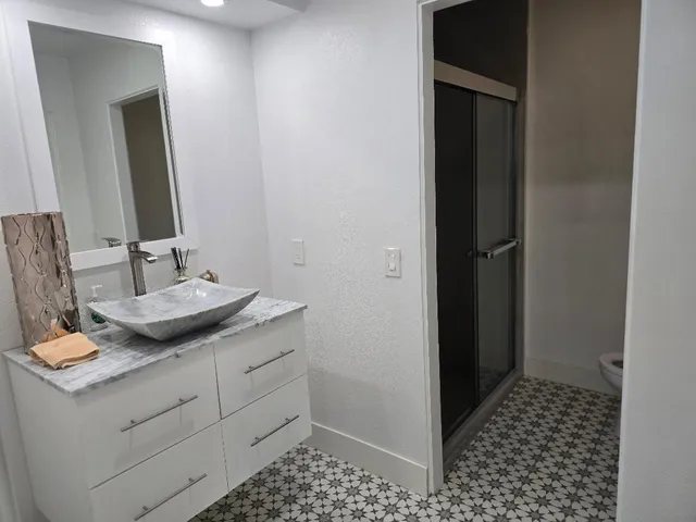 a bathroom with a sink and a mirror