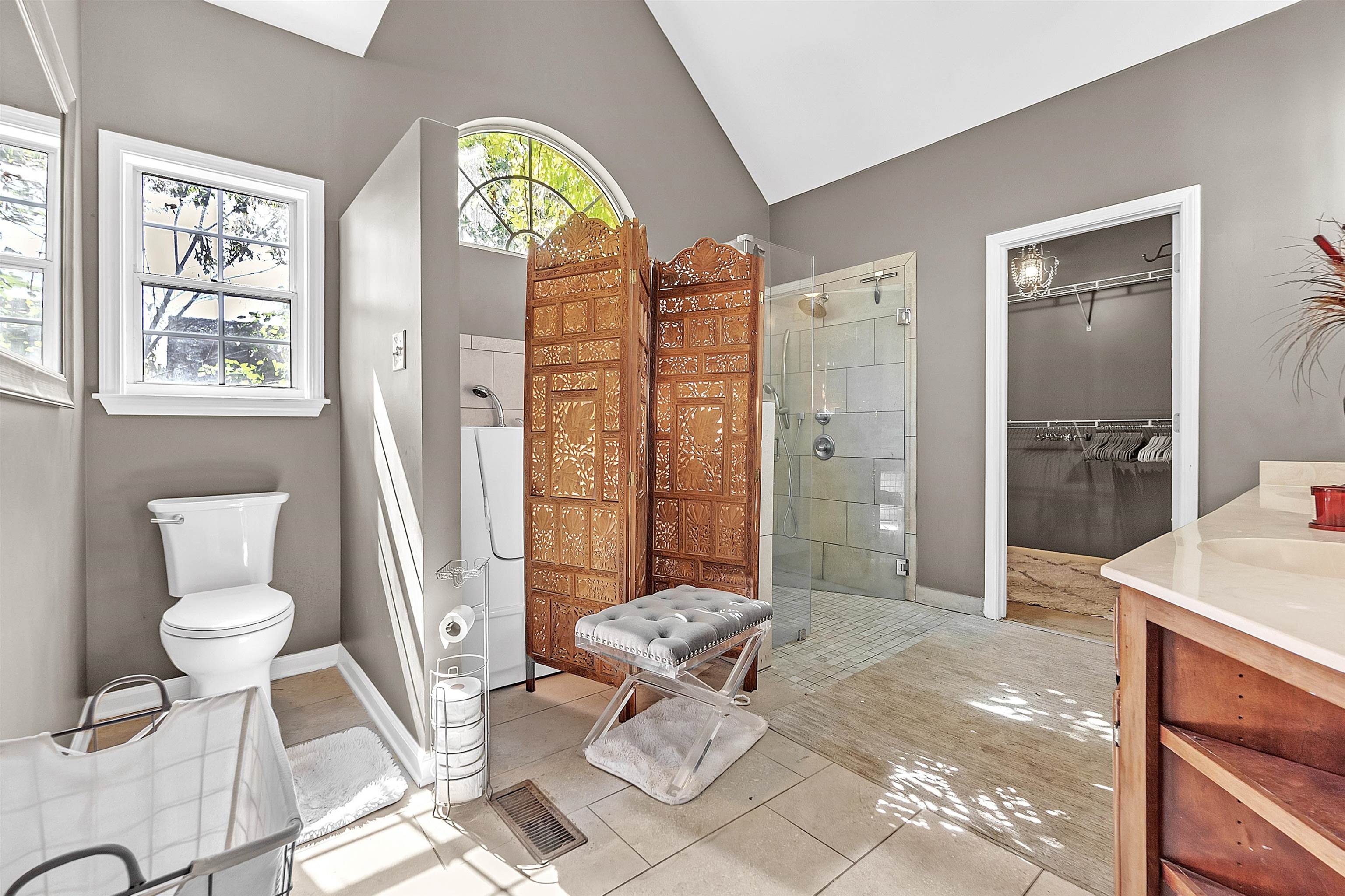 4366 Campground Road Munford, TN 38058 - Photo 24 of 40 Bathroom with a walk in closet, a stall shower, tile patterned flooring, vanity, and plenty of natural light