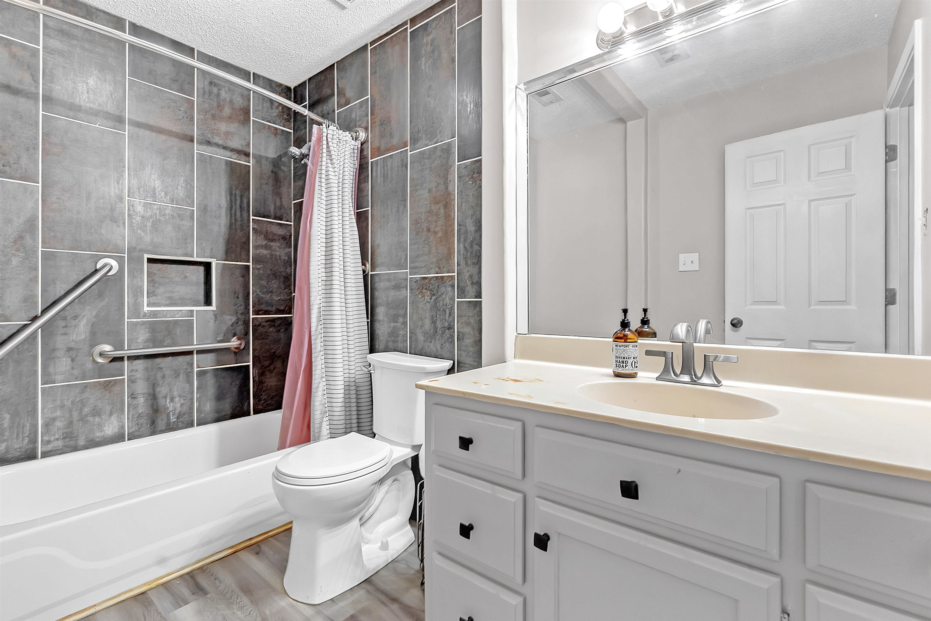 4366 Campground Road Munford, TN 38058 - Photo 32 of 40 Full bath featuring vanity, a textured ceiling, shower / bathtub combination