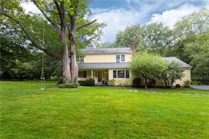 17 Fox Hill Road Pound Ridge, NY 10576 - Photo 1 of 1 a view of a house with a garden