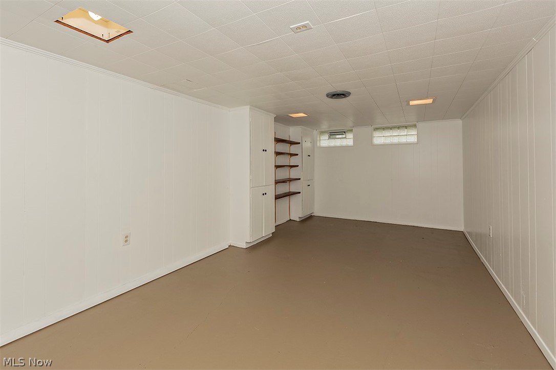 5523 Huron Road Lyndhurst, OH 44124 - Photo 26 of 34 Another view of the bonus recreation area with built-in storage and glass block windows.
