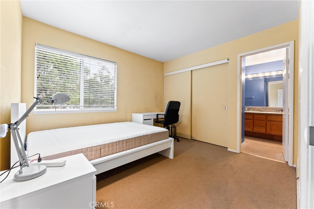 13776 Monteverde Drive Chino Hills, CA 91709 - Photo 12 of 14 a bed room with a bed and a television