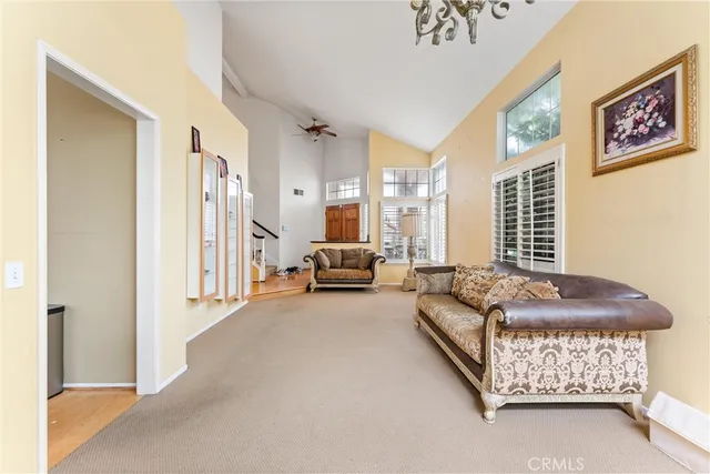 a living room with furniture and a bed
