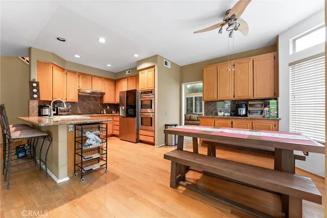 a kitchen with kitchen island granite countertop a sink and counter space