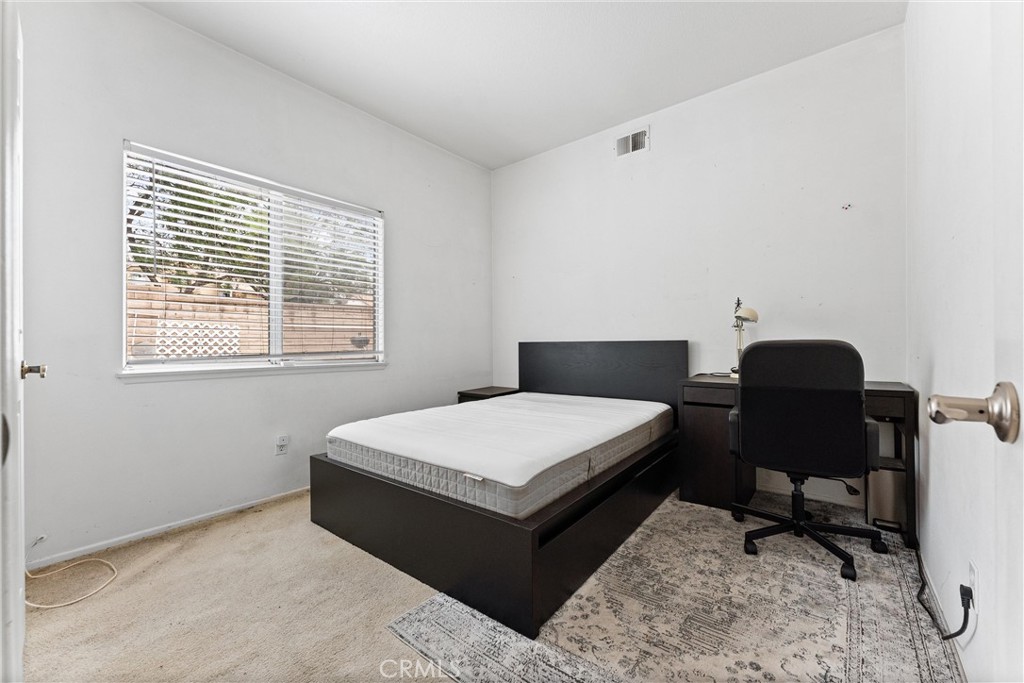 13776 Monteverde Drive Chino Hills, CA 91709 - Photo 6 of 14 a living room with a couch and a dresser next to a window
