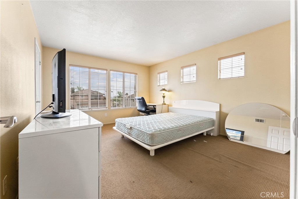 13776 Monteverde Drive Chino Hills, CA 91709 - Photo 10 of 14 a bedroom with bed and a window