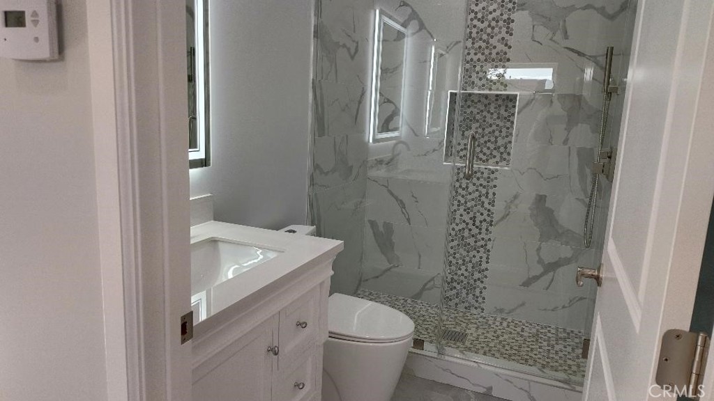 1312 A Cleveland Road Glendale, CA 91202 - Photo 5 of 16 a bathroom with a sink a toilet and shower