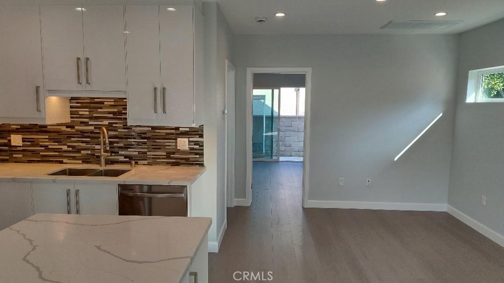 1312 A Cleveland Road Glendale, CA 91202 - Photo 7 of 16 a kitchen with stainless steel appliances granite countertop a stove a sink and a refrigerator