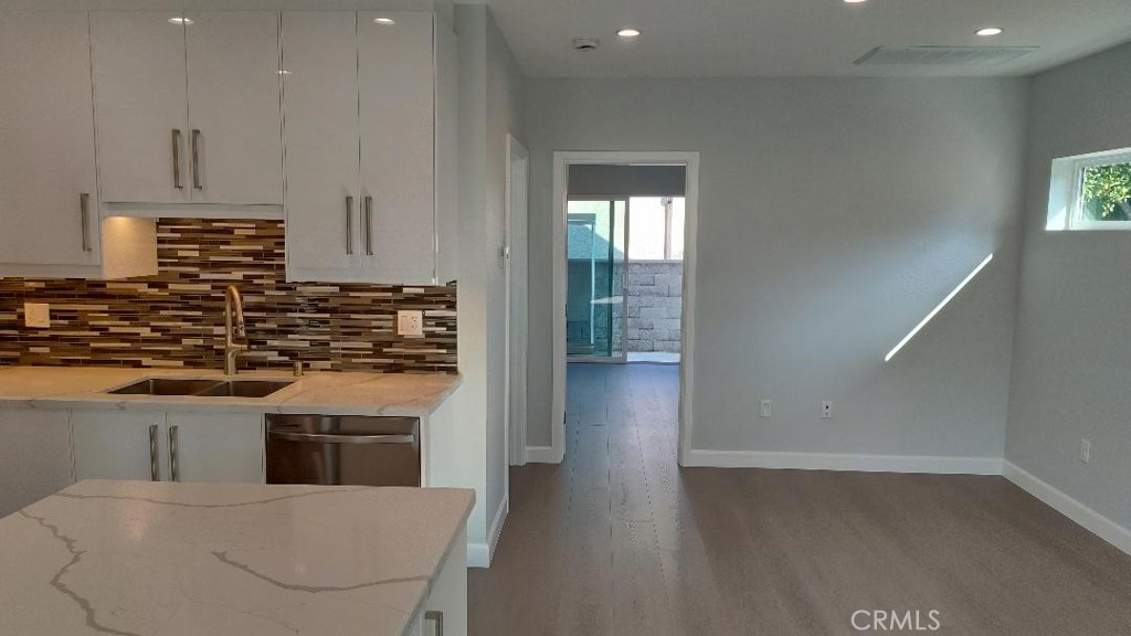 1312 A Cleveland Road Glendale, CA 91202 - Photo 9 of 16 a kitchen with stainless steel appliances granite countertop a stove a sink and a refrigerator