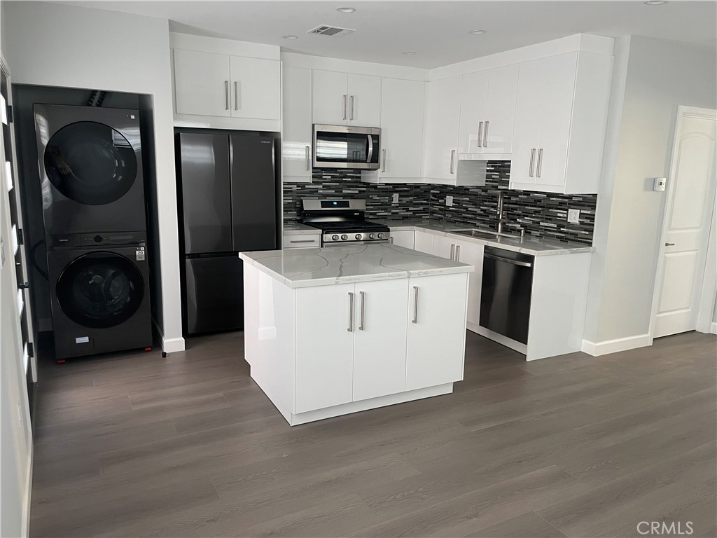1312 A Cleveland Road Glendale, CA 91202 - Photo 10 of 16 a kitchen with a refrigerator and a stove top oven