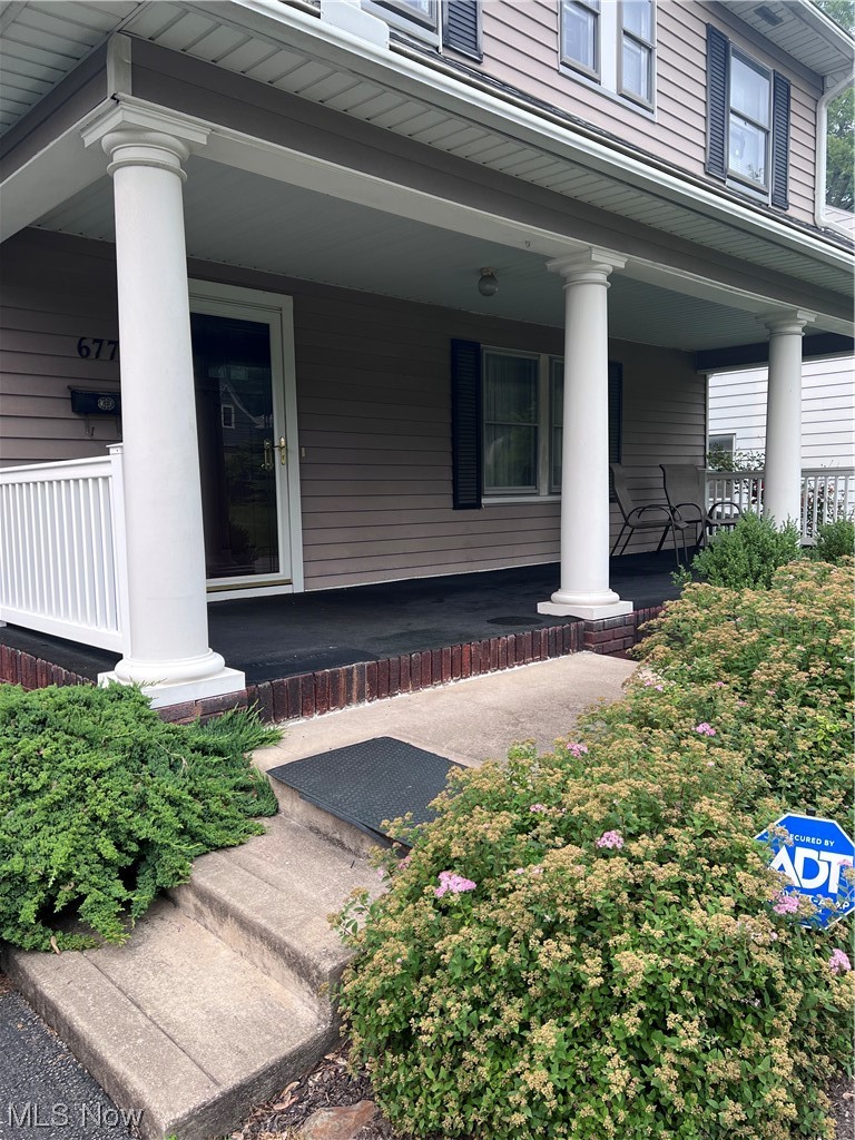 677 Ecton Road Akron, OH 44303 - Photo 2 of 31 Front porch accented with pillars, relax and enjoy sunsets.