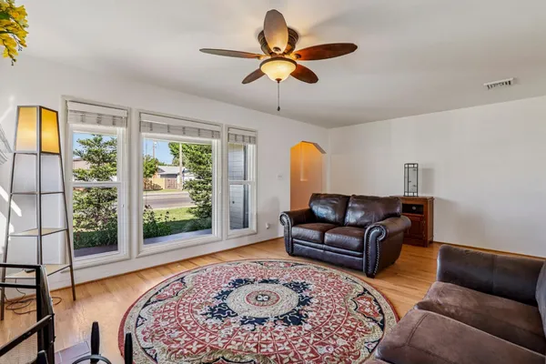 a living room with furniture and a rug