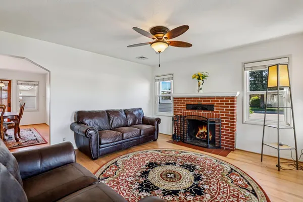 a living room with furniture and a fireplace