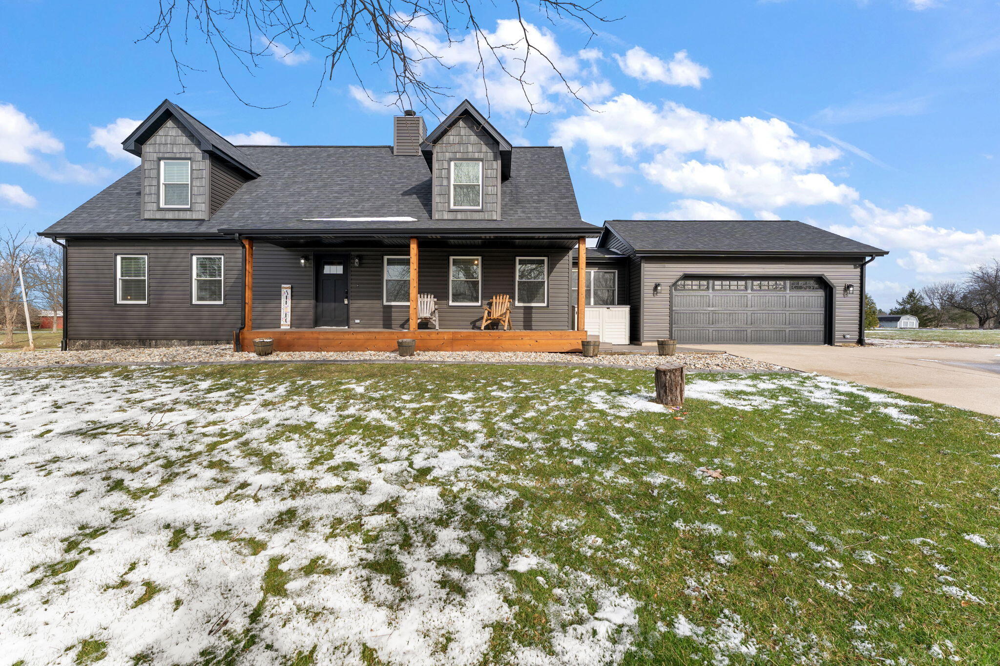a front view of a house with a yard