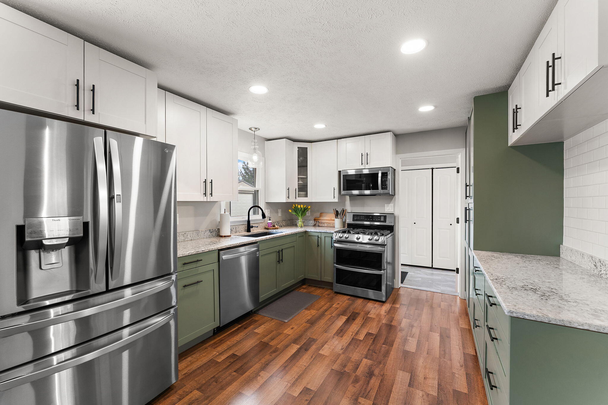 897 Jane Avenue Chesterton, IN 46304 - Photo 12 of 40 a kitchen with stainless steel appliances a refrigerator sink and microwave