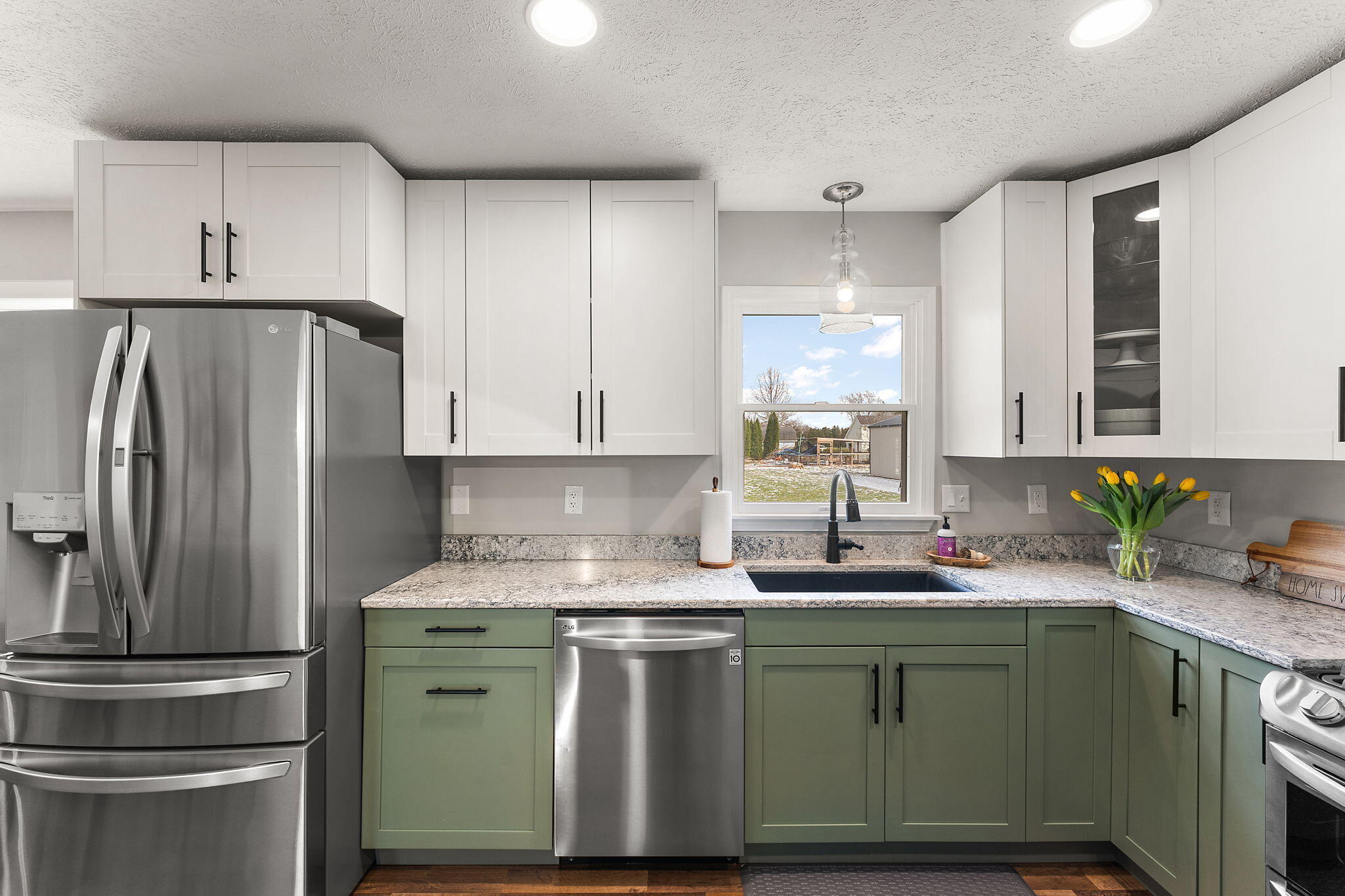 897 Jane Avenue Chesterton, IN 46304 - Photo 14 of 40 a kitchen with stainless steel appliances granite countertop a refrigerator sink and stove