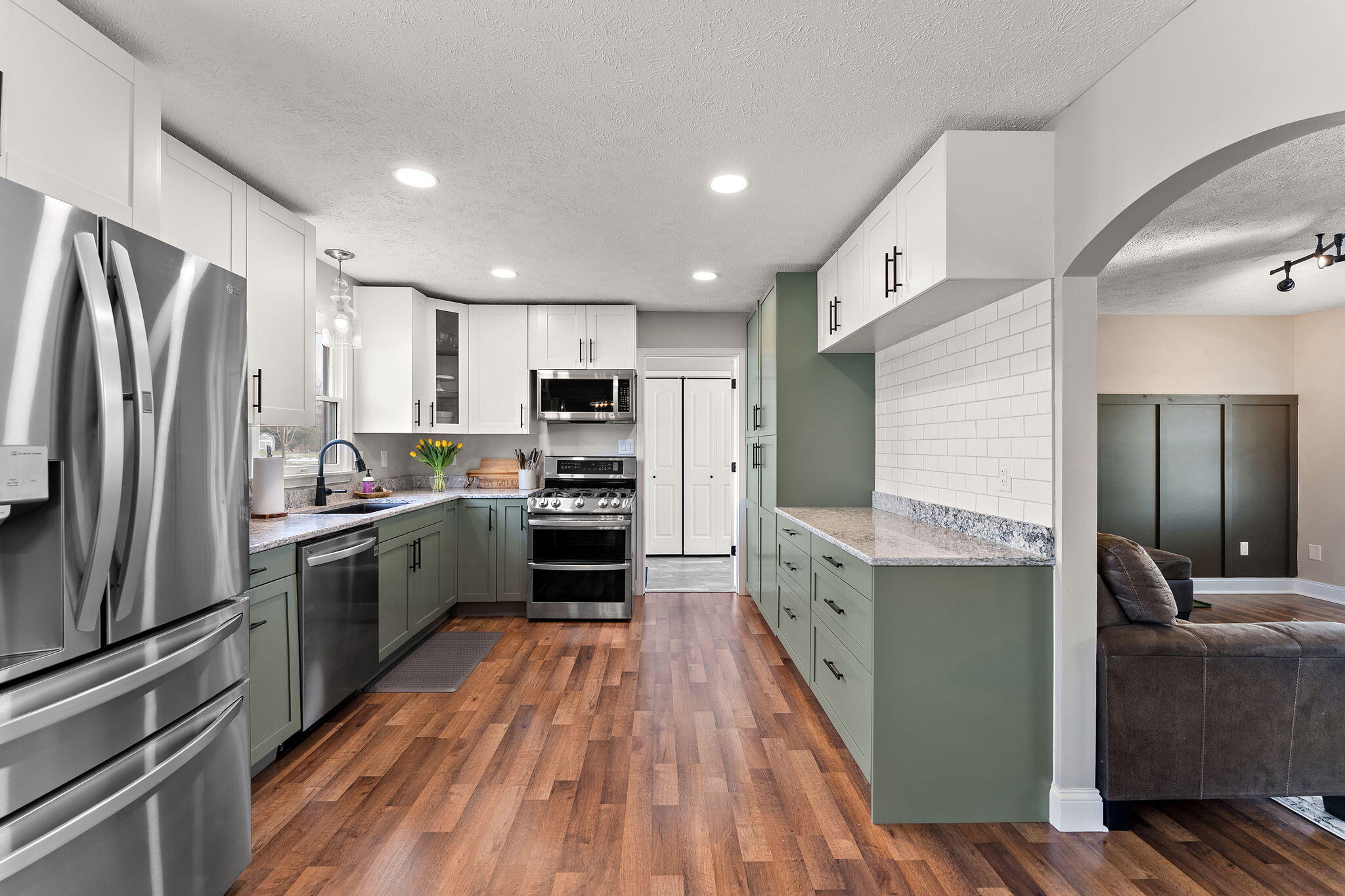 897 Jane Avenue Chesterton, IN 46304 - Photo 15 of 40 a kitchen with stainless steel appliances a refrigerator a sink and wooden cabinets
