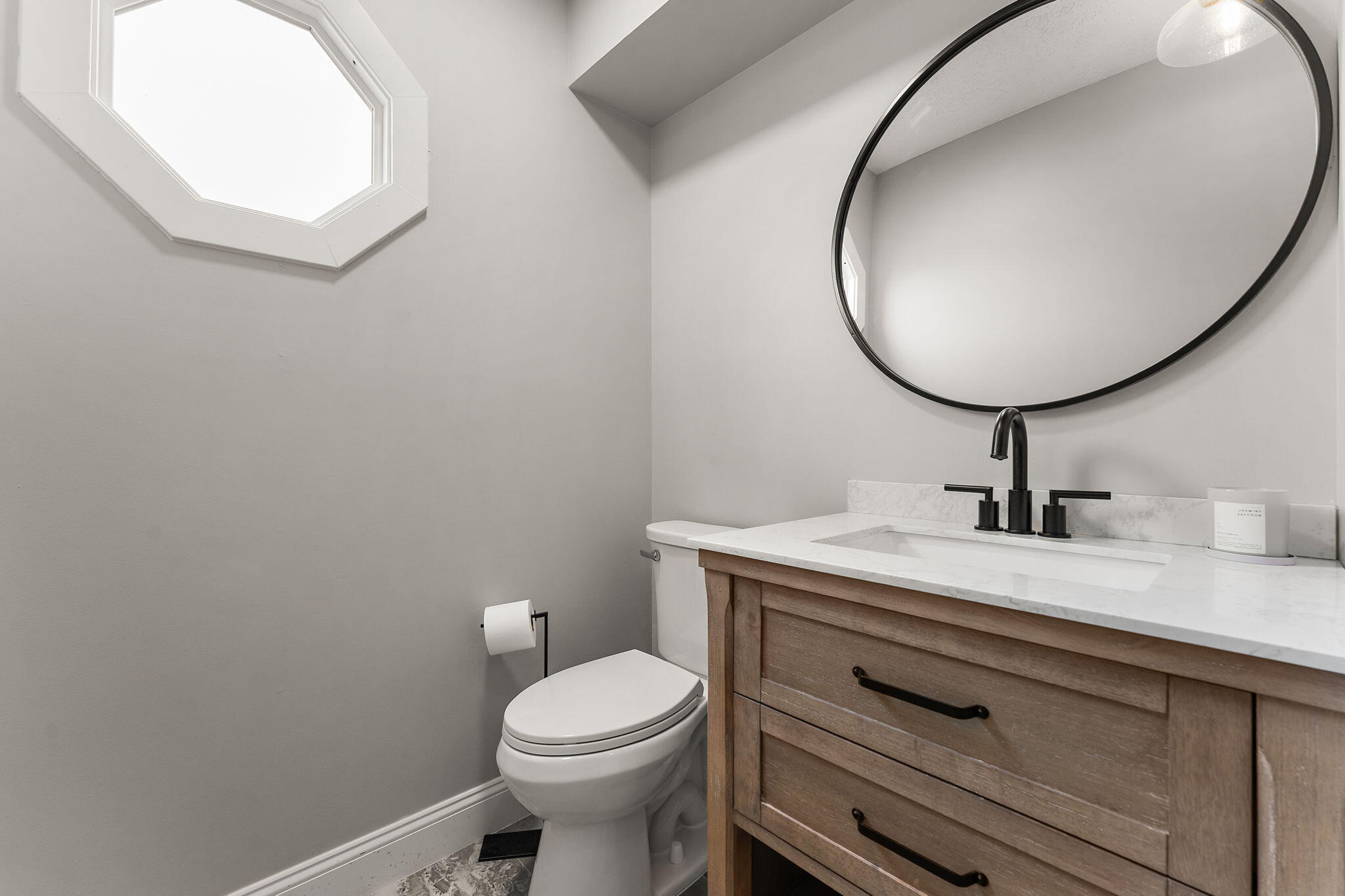 897 Jane Avenue Chesterton, IN 46304 - Photo 18 of 40 a bathroom with a sink a mirror and a toilet