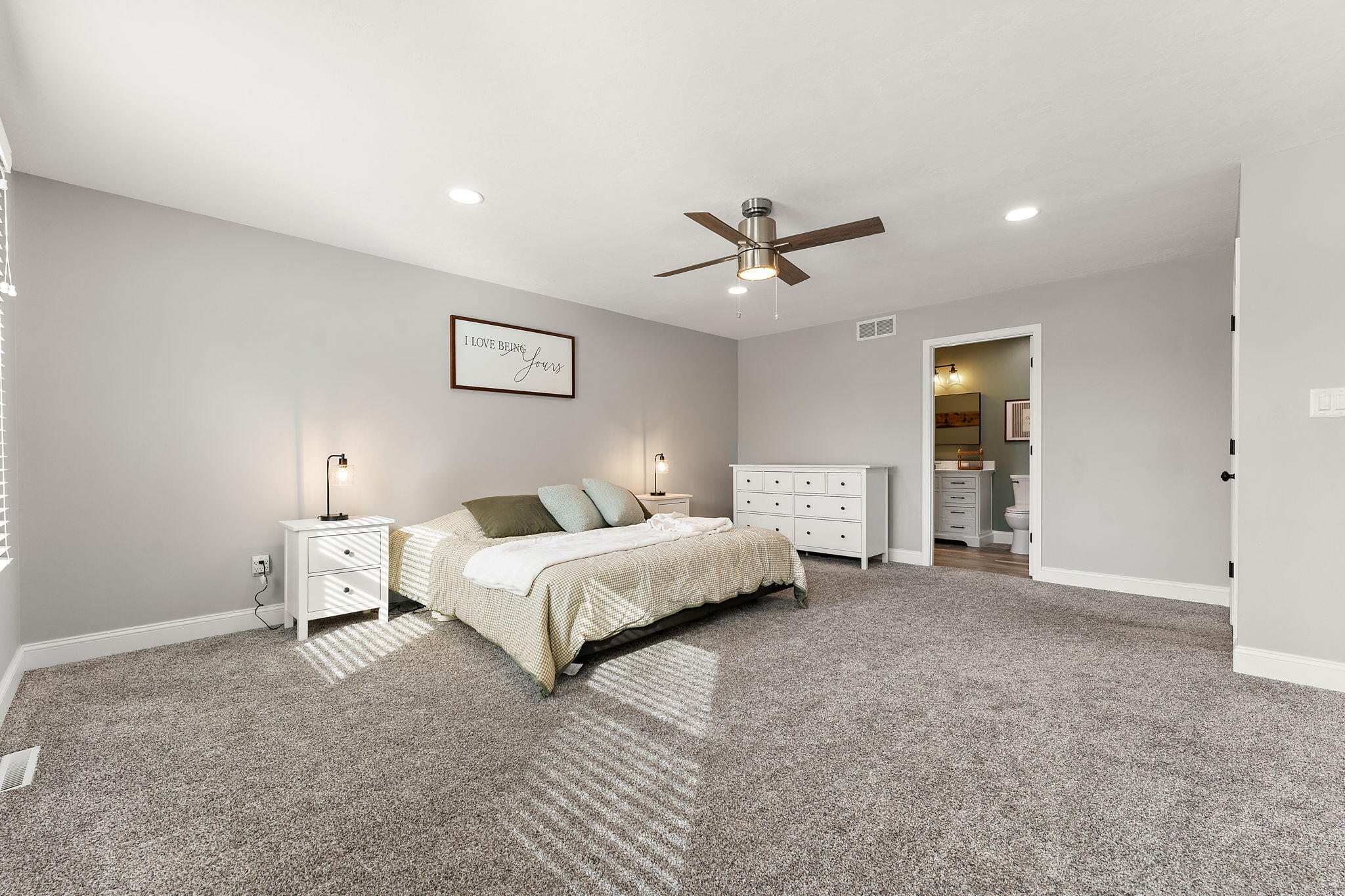 897 Jane Avenue Chesterton, IN 46304 - Photo 20 of 40 a spacious bedroom with a bed and a chandelier