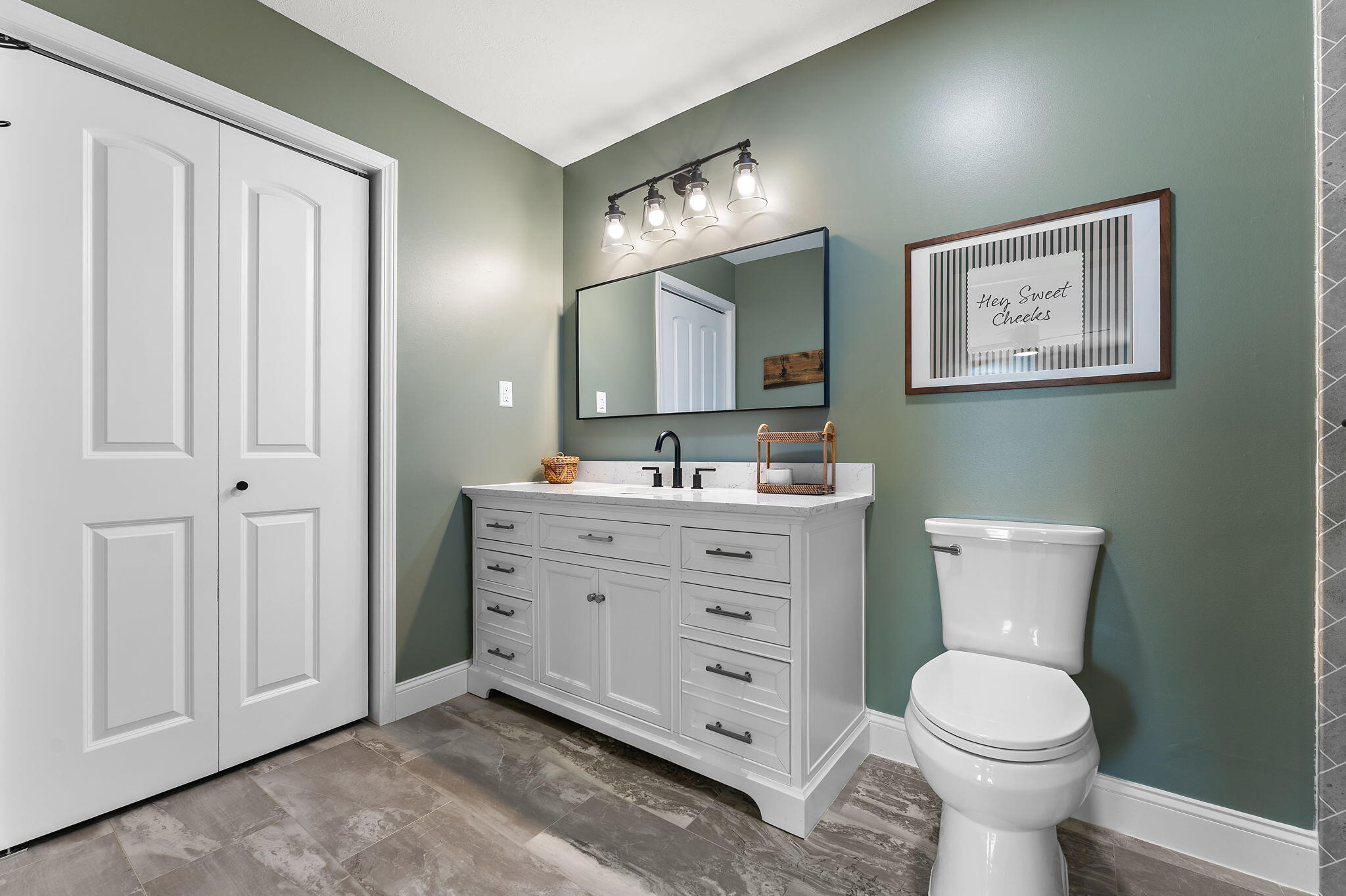 897 Jane Avenue Chesterton, IN 46304 - Photo 21 of 40 a bathroom with a toilet a sink and mirror