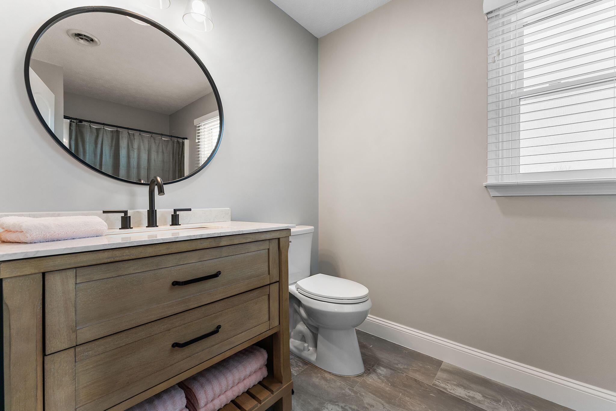 897 Jane Avenue Chesterton, IN 46304 - Photo 27 of 40 a bathroom with a sink mirror and toilet