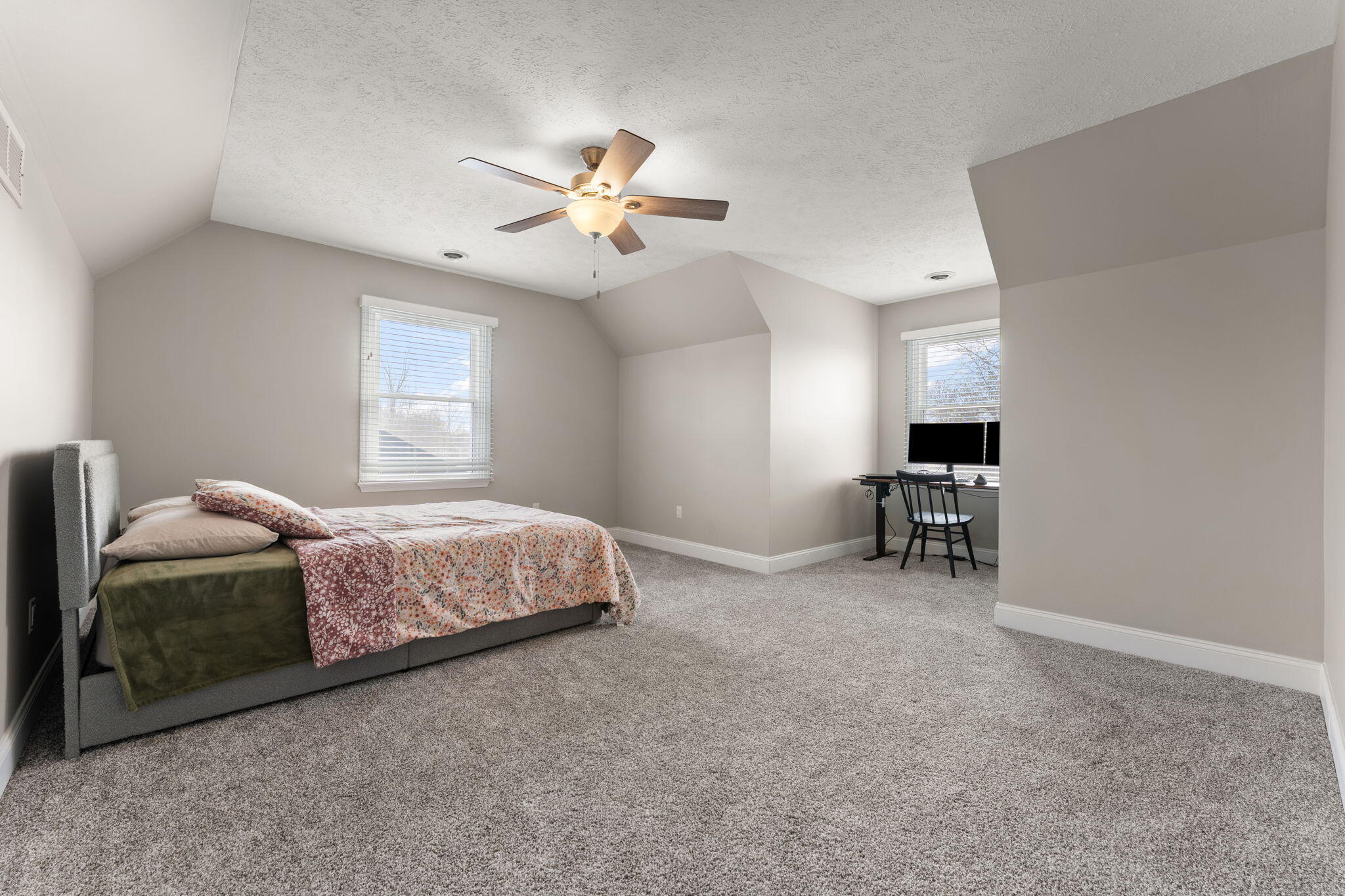 897 Jane Avenue Chesterton, IN 46304 - Photo 29 of 40 a bedroom with a bed and a chandelier