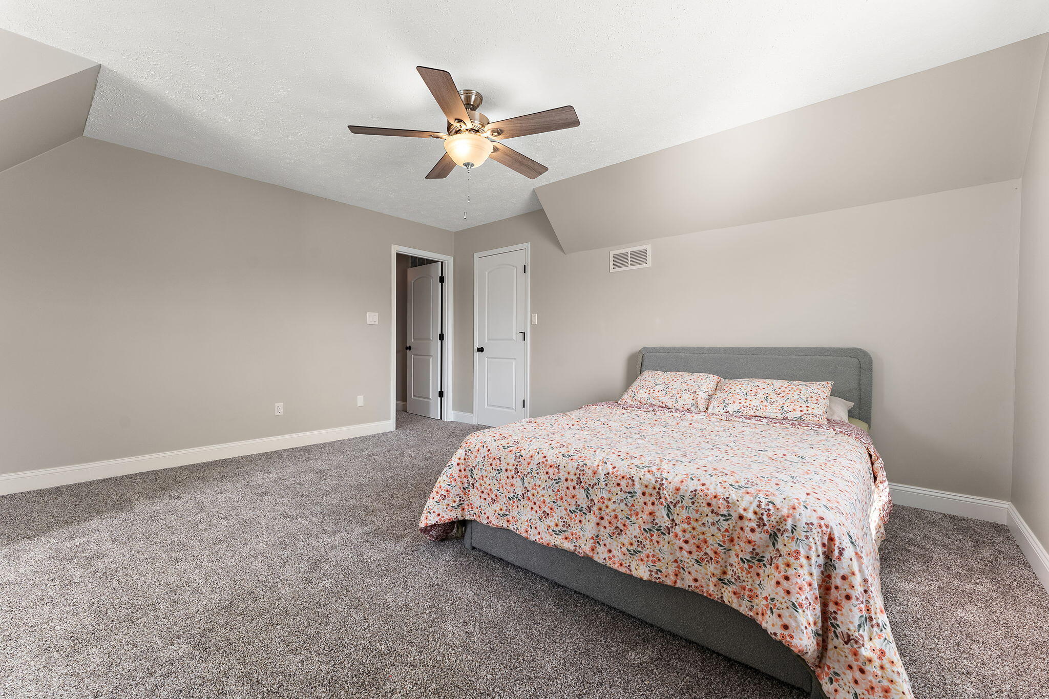 897 Jane Avenue Chesterton, IN 46304 - Photo 31 of 40 a bedroom with a bed and a ceiling fan
