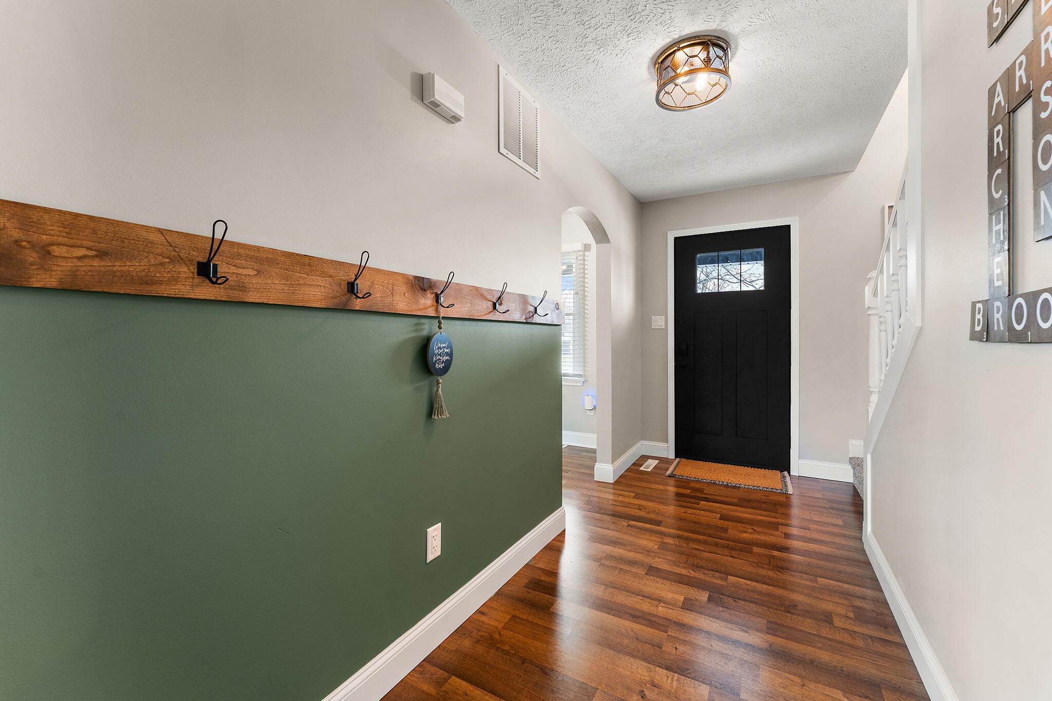 897 Jane Avenue Chesterton, IN 46304 - Photo 4 of 40 a view of a hallway with closet and wooden floor