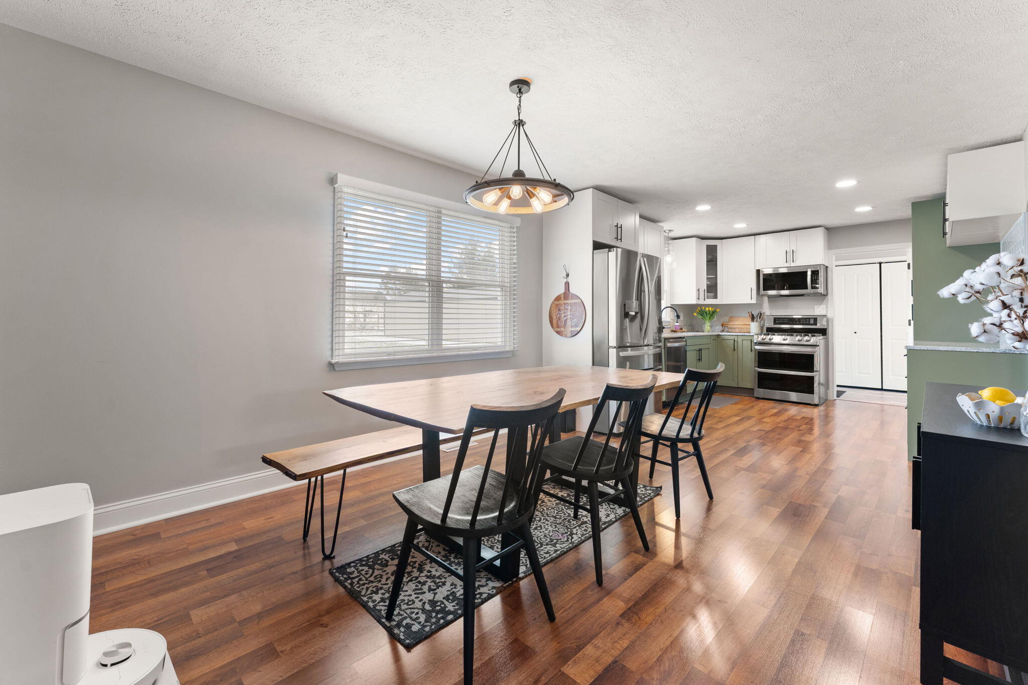 897 Jane Avenue Chesterton, IN 46304 - Photo 10 of 40 a view of a dining room with furniture window and wooden floor