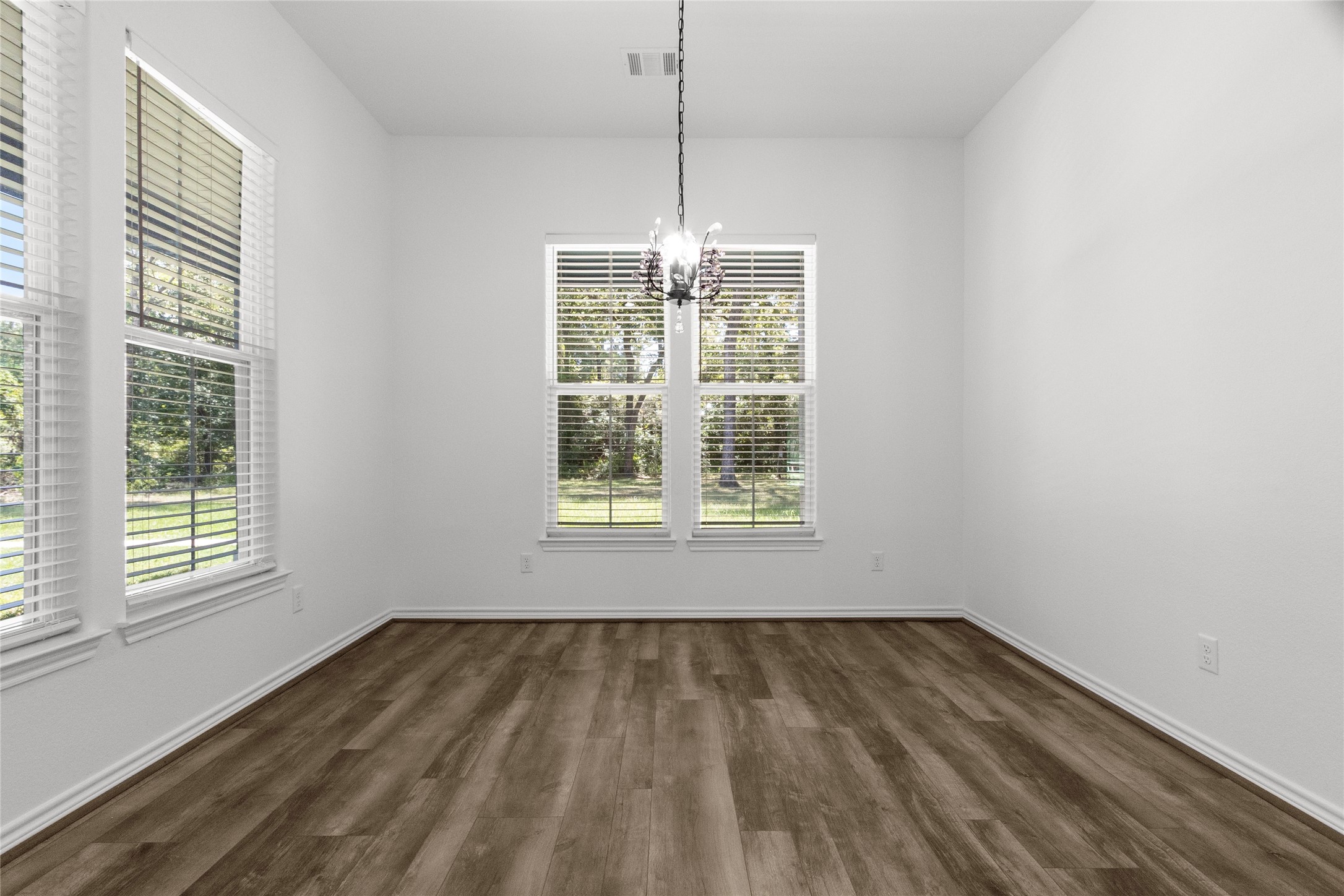16735 Azalea Lane Plantersville, TX 77363 - Photo 14 of 44 a view of empty room with wooden floor and fan