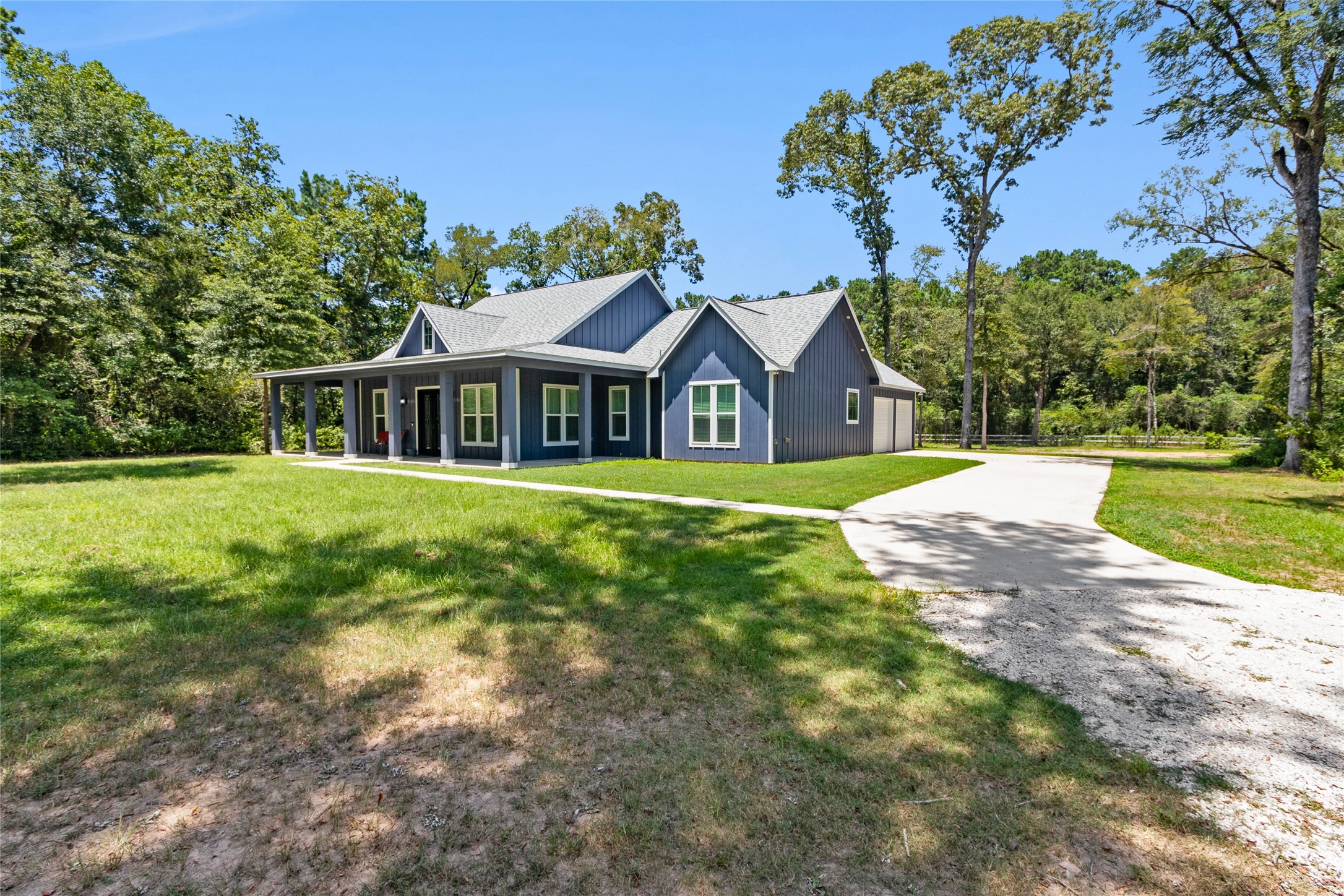 16735 Azalea Lane Plantersville, TX 77363 - Photo 2 of 44 a view of a house with a big yard