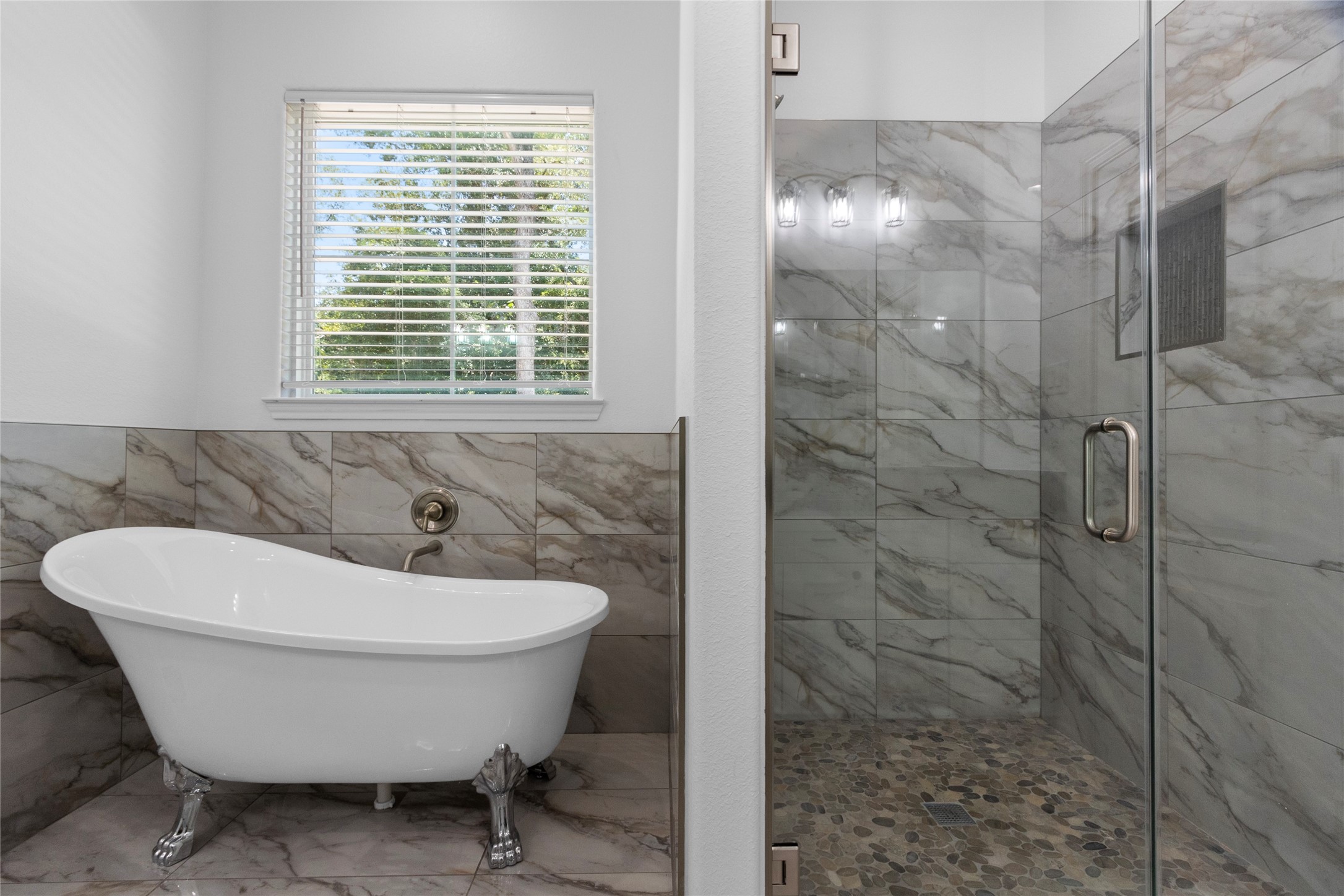 16735 Azalea Lane Plantersville, TX 77363 - Photo 20 of 44 a bathroom with a sink and window